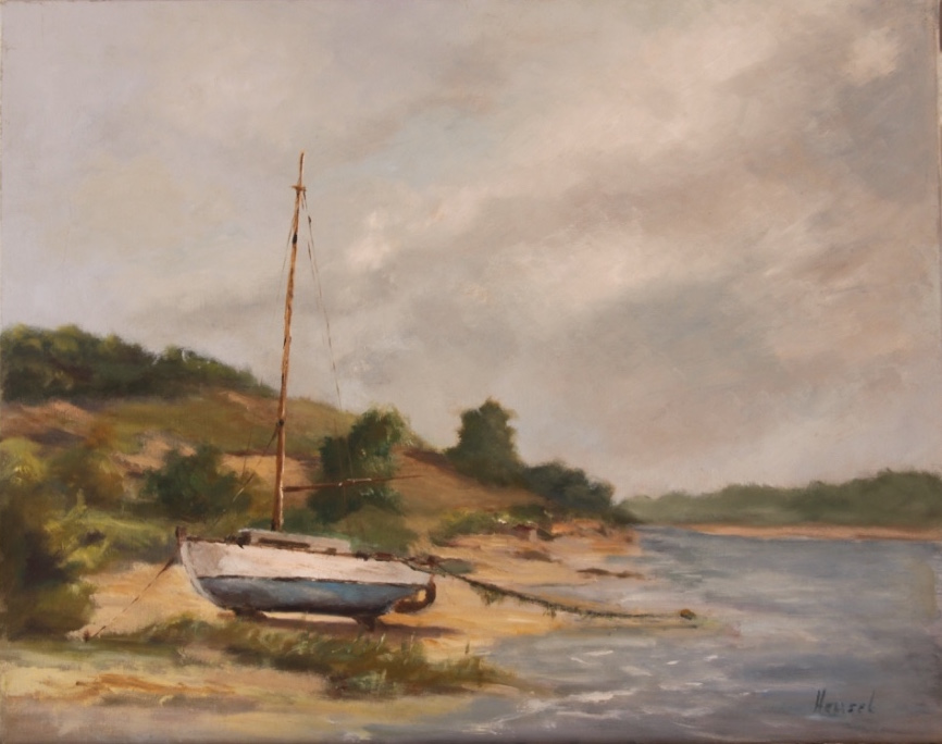 Photo of a sailboat high and dry on a sandbank.